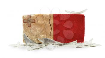 Brick with broken glass, violence concept, flag of Malta