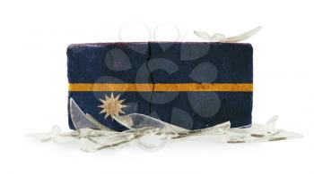 Brick with broken glass, violence concept, flag of Nauru