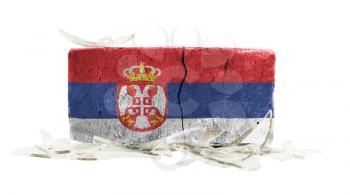 Brick with broken glass, violence concept, flag of Serbia