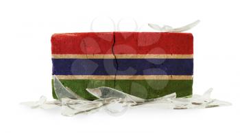 Brick with broken glass, violence concept, flag of The Gambia