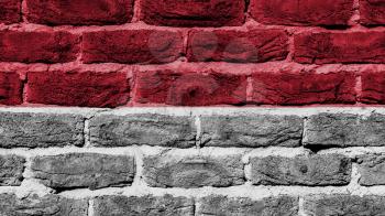 Very old brick wall texture, flag of Monaco