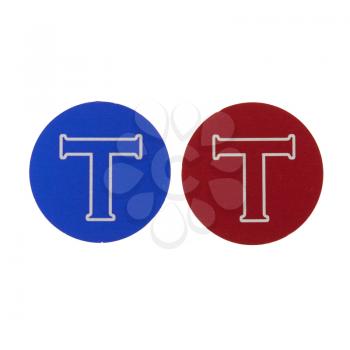 Blue and red coin with the letter T on it