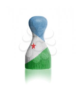 Wooden pawn with a painting of a flag, Djibouti