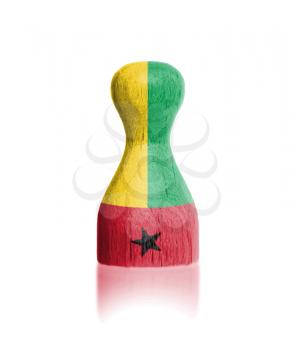 Wooden pawn with a painting of a flag, Guinea-Bissau