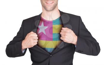 Businessman opening suit to reveal shirt with flag, Togo