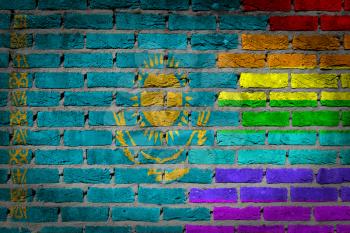 Dark brick wall texture - coutry flag and rainbow flag painted on wall - Kazakhstan