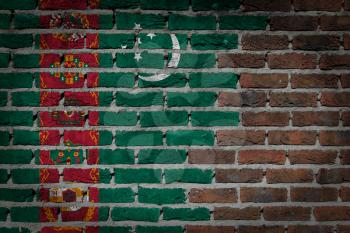 Very old dark red brick wall texture with flag - Turkenistan