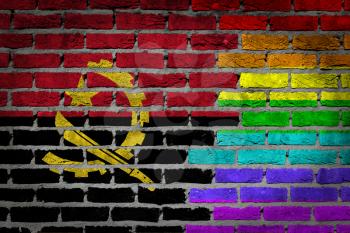 Dark brick wall texture - coutry flag and rainbow flag painted on wall - Angola