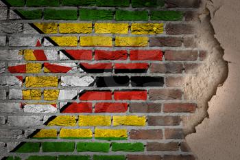 Dark brick wall texture with plaster - flag painted on wall - Zimbabwe