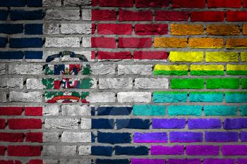 Dark brick wall texture - coutry flag and rainbow flag painted on wall - Dominican Republic