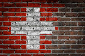 Dark brick wall texture - flag painted on wall - Switzerland