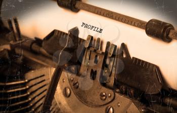 Close-up of an old typewriter with paper, selective focus, Profile