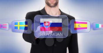 Hand pushing on a touch screen interface, choosing language or country, Slovakia