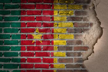 Dark brick wall texture with plaster - flag painted on wall - Cameroon