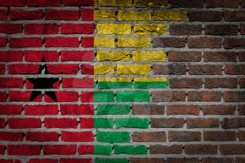 Very old dark red brick wall texture with flag - Guinea Bissau