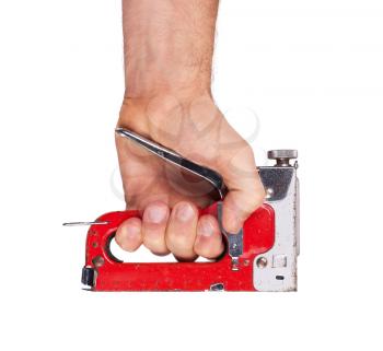 Staple gun in hand isolated on white background