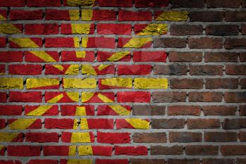 Very old dark red brick wall texture with flag - Macedonia