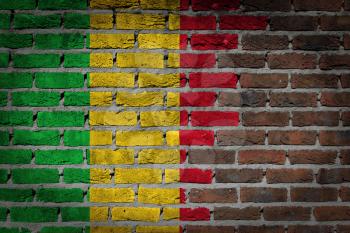 Very old dark red brick wall texture with flag - Mali