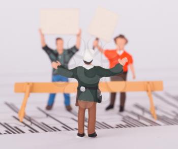 Tiny person demonstrating on a graph, selective focus  - Empty sign