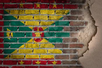 Dark brick wall texture with plaster - flag painted on wall - Grenada