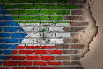 Dark brick wall texture with plaster - flag painted on wall - Equatorial Guinea