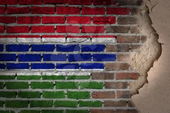 Dark brick wall texture with plaster - flag painted on wall - Gambia