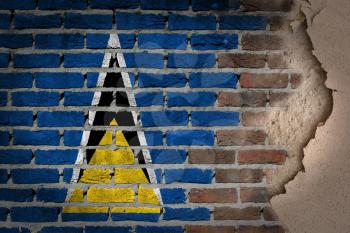 Dark brick wall texture with plaster - flag painted on wall - Saint Lucia