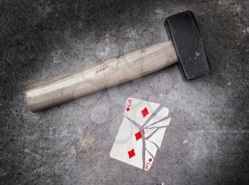 Hammer with a broken card, vintage look,  three of diamonds