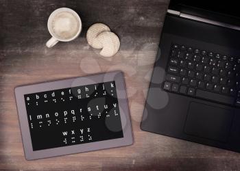 Braille on a tablet, concept of impossibility, vintage look