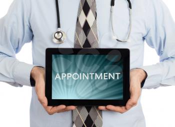 Doctor, isolated on white backgroun,  holding digital tablet - Appointment