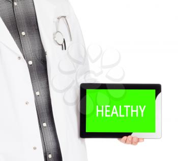 Doctor holding tablet, isolated on white - Healthy