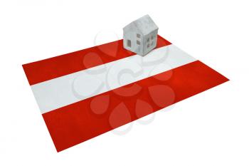 Small house on a flag - Living or migrating to Austria