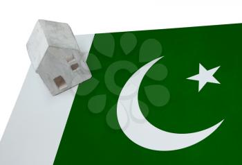 Small house on a flag - Living or migrating to Pakistan
