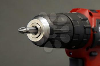 Cordless screwdriver or power drill isolated on a black background