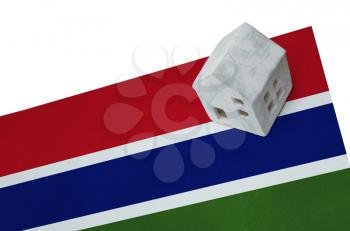 Small house on a flag - Living or migrating to Gambia