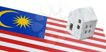 Small house on a flag - Living or migrating to Malaysia