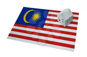 Small house on a flag - Living or migrating to Malaysia
