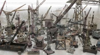 Very old toy, a metal crane, small collection