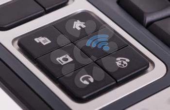 Buttons on a keyboard, selective focus on the middle right button - WiFi