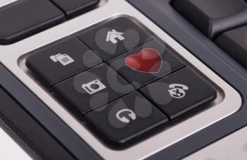 Buttons on a keyboard, selective focus on the middle right button - Love