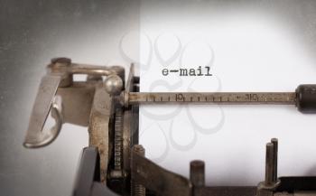 Close-up of an old typewriter with paper, perspective, selective focus, e-mail