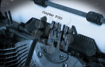 Close-up of an old typewriter with paper, perspective, selective focus, chapter four