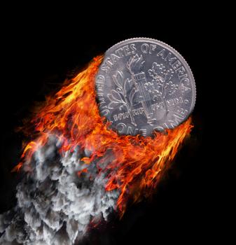 Burning coin with a trail of fire and smoke - one dime