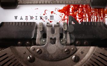 Bloody note - Vintage inscription made by old typewriter, Warning