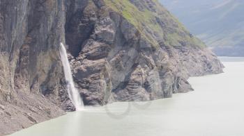 Waterfall at Lake Dix - Dam Grand Dixence - Switzerland, worlds tallest gravity dam