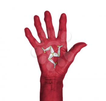 Palm of a woman hand, painted with flag of Isle of Man