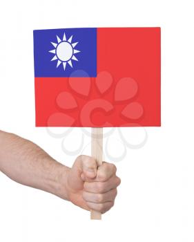 Hand holding small card, isolated on white - Flag of Taiwan