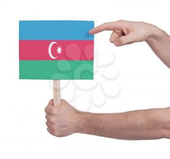 Hand holding small card, isolated on white - Flag of Azerbaijan