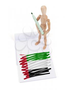 Wooden mannequin made a drawing of a flag - UAE
