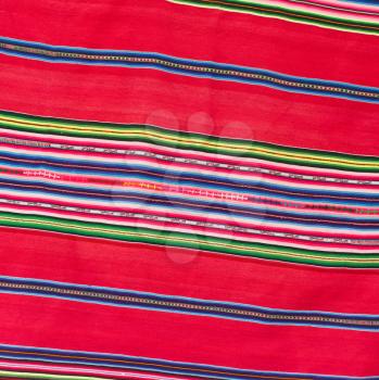 Closeup of a tablecloth made of linen with colorful stripes